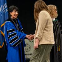 president shaking hand